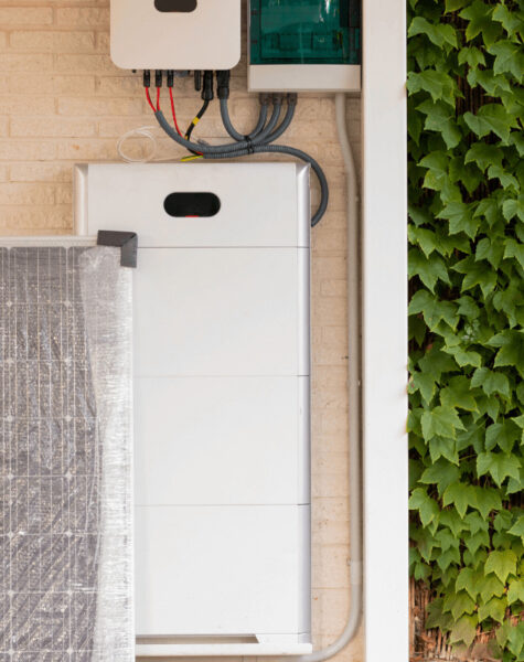 solar battery storage installed on side of brick house