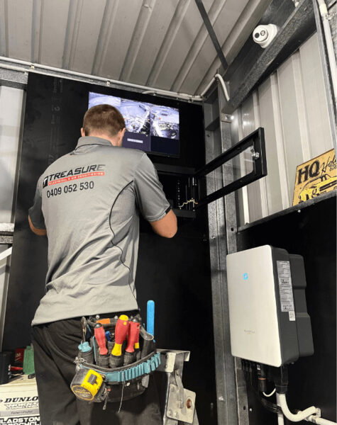 electrician installing security camera